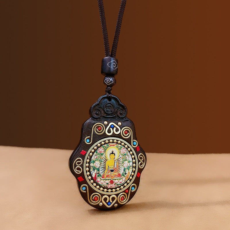 Pendentif Bouddha tibétain en bois – Symboles sacrés et sagesse