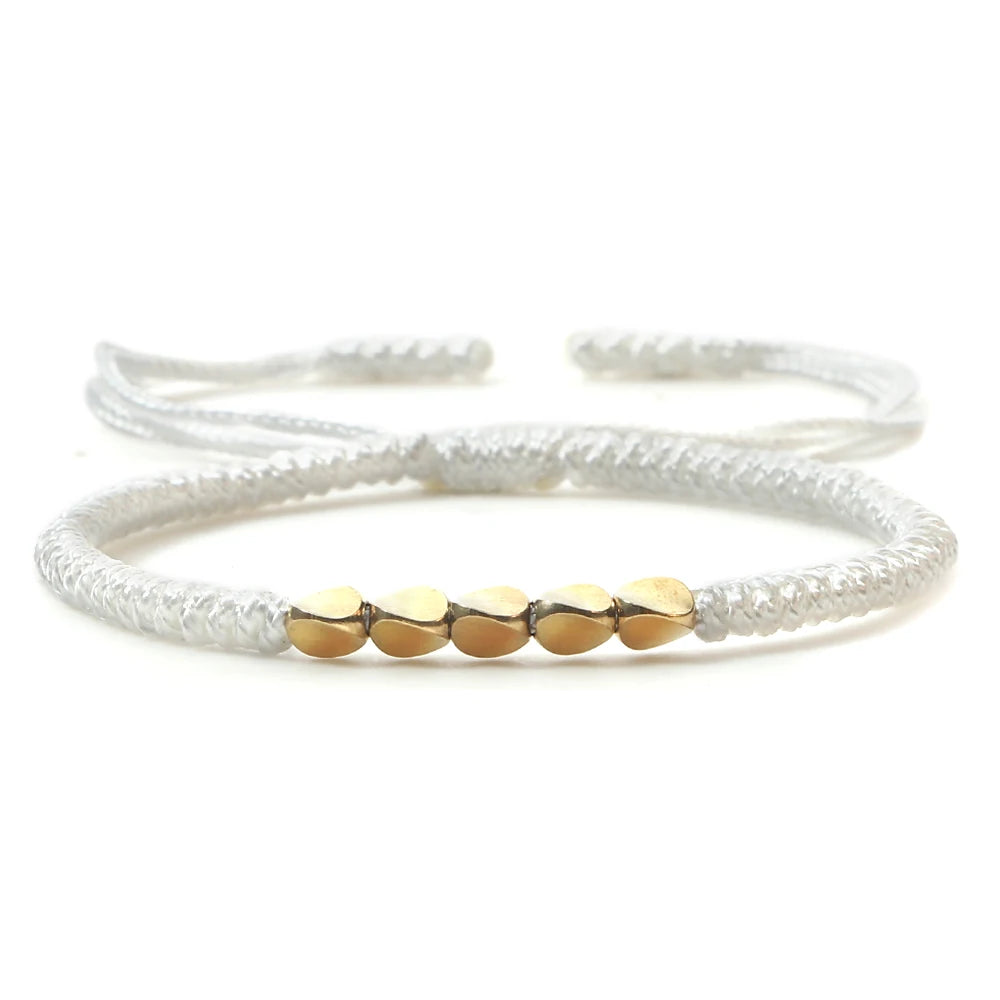 Bracelet tibétain bouddhiste – Cordon tressé et perles en cuivre