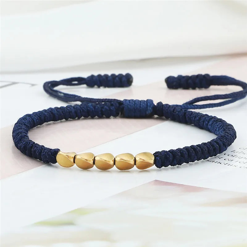 Bracelet tibétain bouddhiste – Cordon tressé et perles en cuivre
