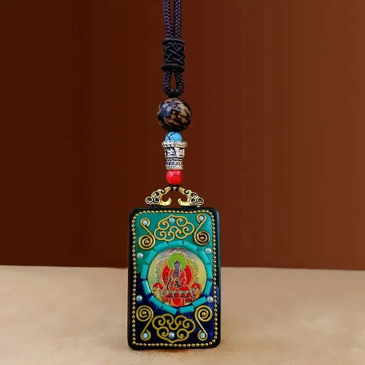 Pendentif Bouddha tibétain en bois – Symboles sacrés et sagesse Esprit Tibet Bouddha Serein 